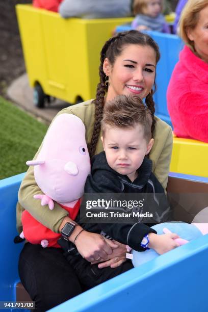 Sarah Lombardi and her son Alessio Lombardi test the new kids area 'Peppa Pig Land 'at Heide Park Resort theme park on April 4, 2018 in Soltau,...