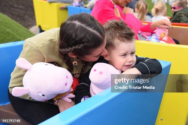 Sarah Lombardi and her son Alessio Lombardi test the new kids area 'Peppa Pig Land 'at Heide Park Resort theme park on April 4, 2018 in Soltau,...