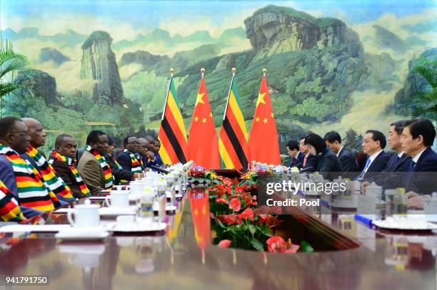 Zimbabwean President Emmerson Mnangagwa and Chinese Premier Li Keqiang during a meeting at the Great Hall of the People on April 4, 2018 in Beijing,...