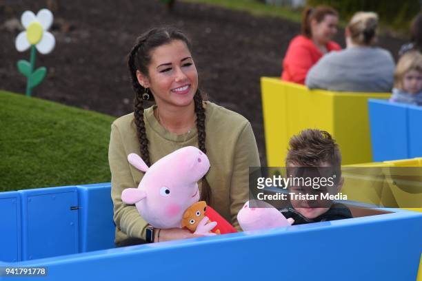 Sarah Lombardi and her son Alessio Lombardi test the new kids area 'Peppa Pig Land 'at Heide Park Resort theme park on April 4, 2018 in Soltau,...