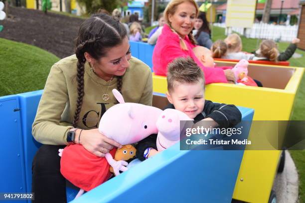 Sarah Lombardi with her son Alessio Lombardi and Caroline Beil with her daughter Ava Beil test the new kids area 'Peppa Pig Land 'at Heide Park...