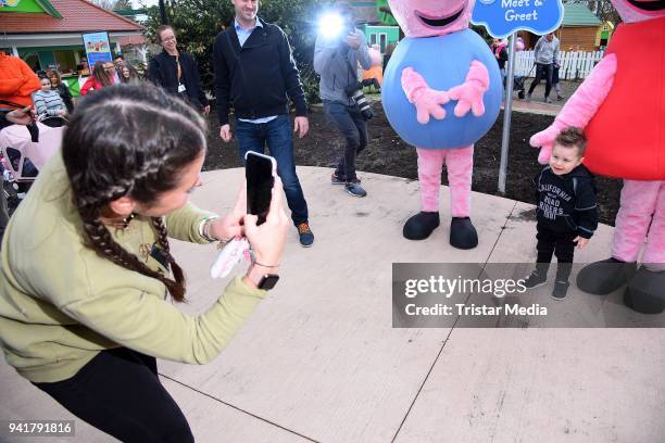 Sarah Lombardi and her son Alessio Lombardi test the new kids area 'Peppa Pig Land 'at Heide Park Resort theme park on April 4, 2018 in Soltau,...