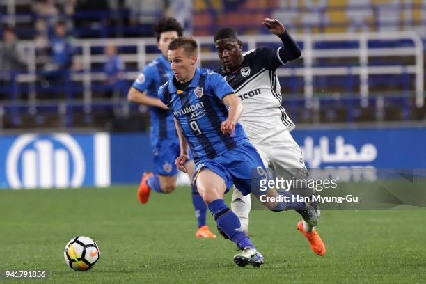 Mislav Orsic of Ulsan Hyndai goes past Leroy George of Melbourne Victory during the AFC Champions League Group F match between Ulsan Hyundai and...