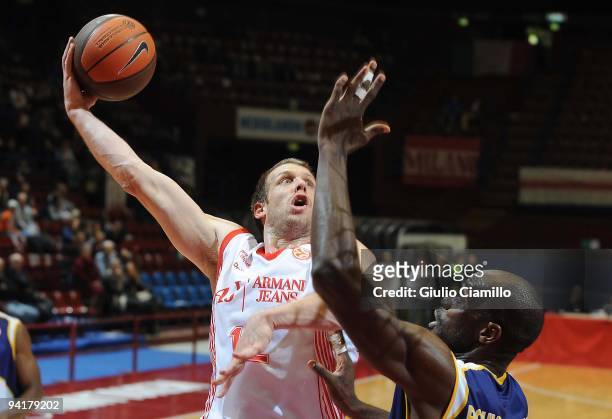 Mason Rocca, #12 of Armani Jeans Milano shoots over Ruben Boumtje, #44 of Ewe Baskets Oldenburg during the Euroleague Basketball Regular Season...