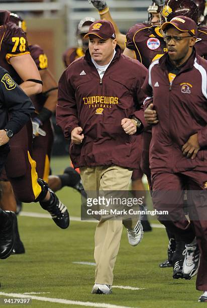 Central Michigan Chippewas head coach Butch Jones runs onto the field before the start of the MAC Conference Championship game against the Ohio...