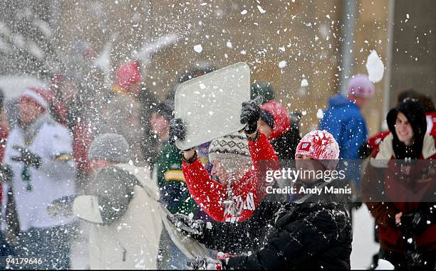 Tyler Spriggs, right, a junior at the University of Wisconsin-Madison, battles in a campus-wide snowball fight on Bascom Hil December 9, 2009 in...