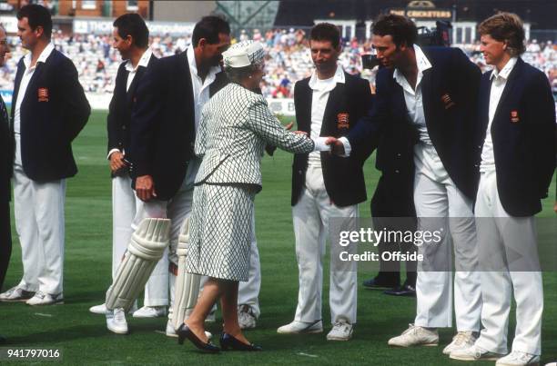 July 1991 Kennington Oval, County Cricket Championship, Surrey v Essex - Her Majesty The Queen is introduced to Derek Pringle by Essex captain Graham...