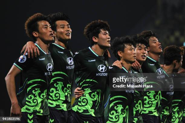 Jeonbuk Hyundai Motors players applaud supporters after their 2-0 victory in the AFC Champions League Group E match between Kashiwa Reysol and...