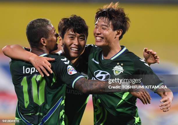 Jeonbuk forward Lee Dong-gook celebrates after a goal with teammates Ricardo Lopes and Hong Jeong-ho during the AFC Champions League Group E football...