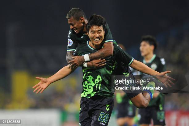 Lee Dong-gook of Jeonbuk Hyundai Motors celebrates scoring his side's second goal with his team mate Ricardo Lopes during the AFC Champions League...