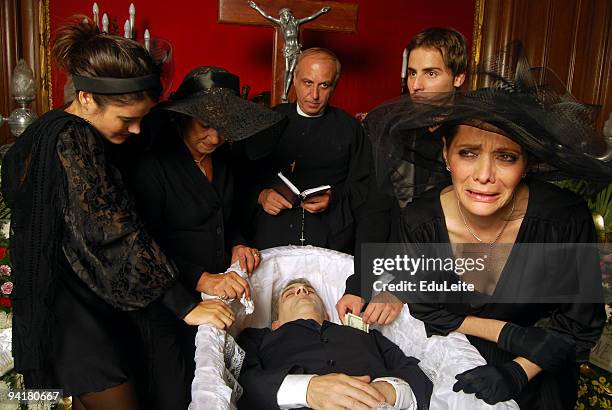 stealing the dead - family funeral stock pictures, royalty-free photos & images