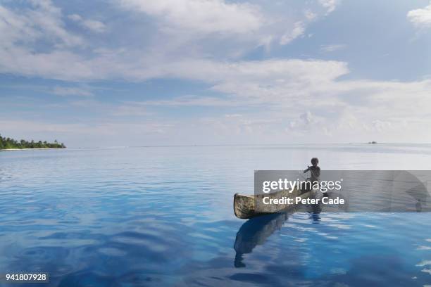 pacific island child in homemade canoe - dugout canoe stock pictures, royalty-free photos & images