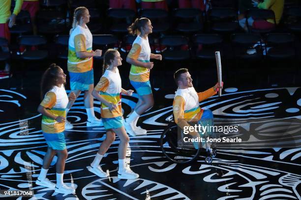 Kurt Fearnley holds the Queens Baton during the Opening Ceremony for the Gold Coast 2018 Commonwealth Games at Carrara Stadium on April 4, 2018 on...