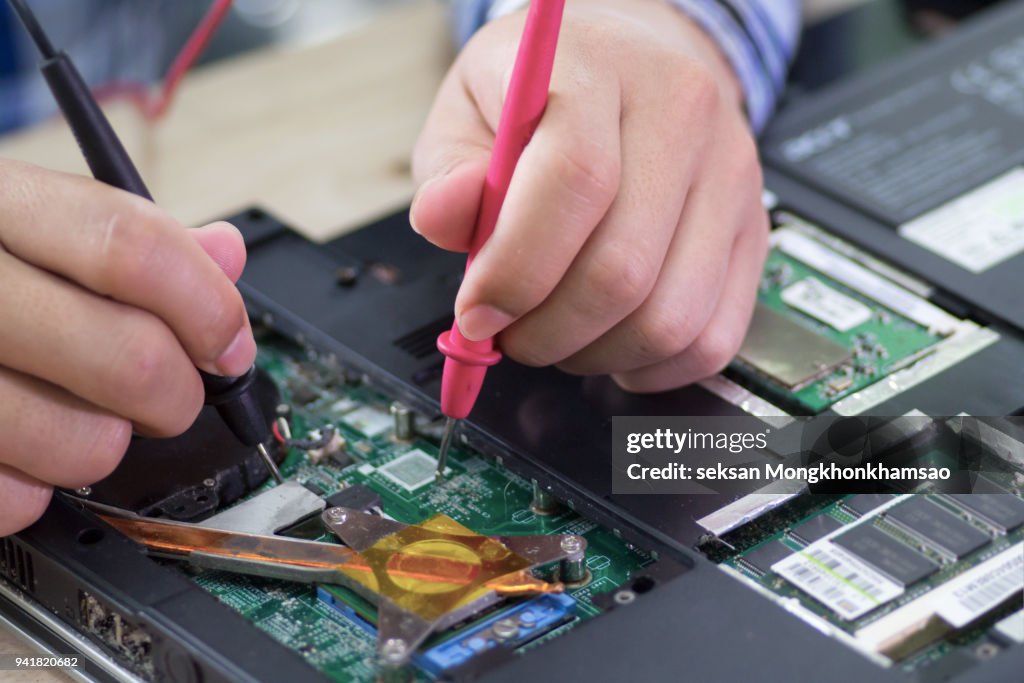 Repaiting Lab Computers Technician Repairing Computer Hardware In The Lab High-Res Stock Photo ...
