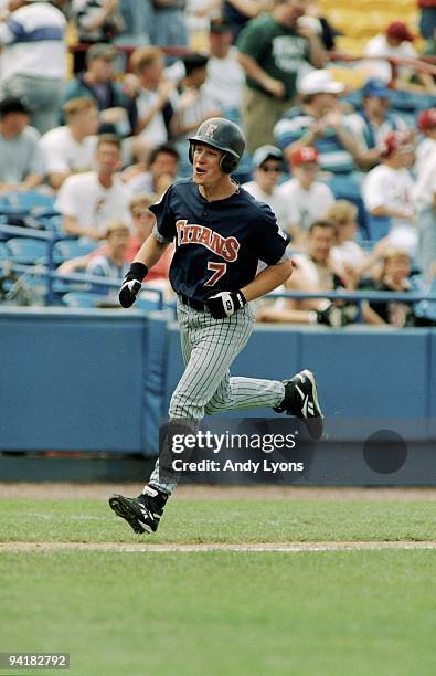 Mark Kotsay of the Cal State Fullerton Titans rounds the bases after hitting a home run during the game against the Tennessee Volunteers in the 1995...