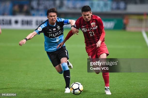 Yu Hai of Shanghai SIPG and Yusuke Tasaka of Kawasaki Frontale compete for the ball during AFC Champions League Group F match between Shanghai SIPG...