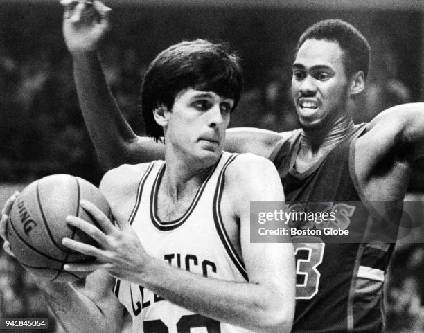 Milwaukee Bucks Alton Lister, right, closely guards Boston Celtics Kevin McHale, left, during a game at the Boston Garden, Nov. 2, 1983.