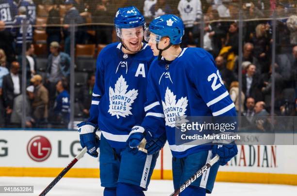 Connor Brown and Morgan Rielly of the Toronto Maple Leafs celebrate after defeating the Buffalo Sabres at the Air Canada Centre on April 2, 2018 in...