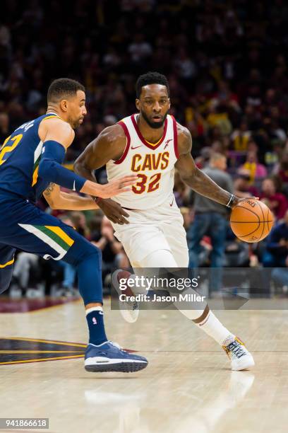 Thabo Sefolosha of the Utah Jazz guards Jeff Green of the Cleveland Cavaliers during the first half at Quicken Loans Arena on December 16, 2017 in...