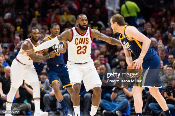 LeBron James of the Cleveland Cavaliers guards Joe Ingles of the Utah Jazz during the first half at Quicken Loans Arena on December 16, 2017 in...