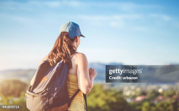 girl on mountain top - vista posterior stock pictures, royalty-free photos & images