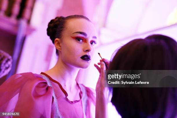 Model prepares backstage before the 25th edition of contest "EDHEC Talons Aiguilles - Young designer's fashion show" on April 3, 2018 in Lille,...