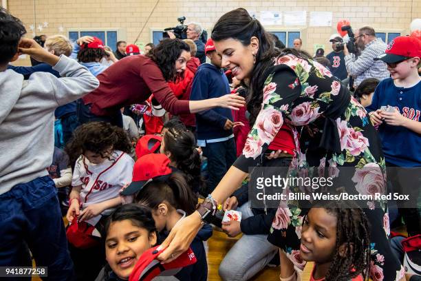 Boston Red Sox Foundation Board Member Linda Pizzuti Henry distributes hats to students hat donation event at the Hurley School on April 4, 2018 in...