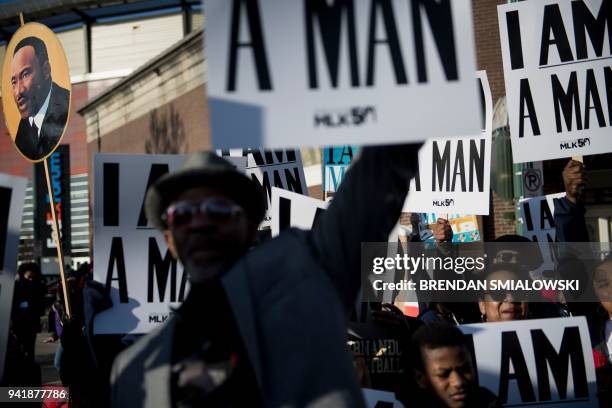 People wait to march to commemorate the 50th anniversary of the assassination of Martin Luther King Jr. April 4, 2018 in Memphis, Tennessee. / AFP...