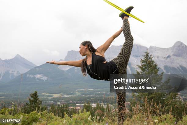 native american woman dances with hoops, in mountains - hooping stock pictures, royalty-free photos & images