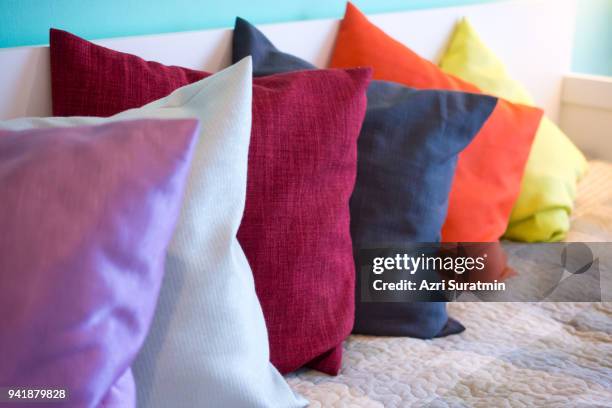 decorative comfortable pillow natural fabric, with multi-colored pillows - cushion imagens e fotografias de stock
