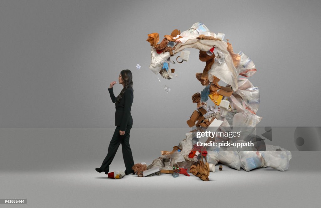 Woman's trash threatens covers her