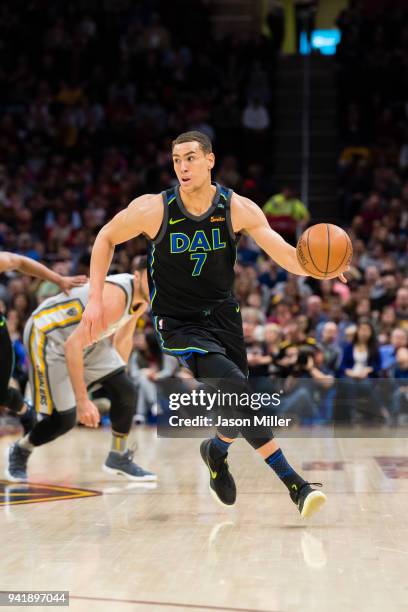 Dwight Powell of the Dallas Mavericks drives down court against the Cleveland Cavaliers during the first half at Quicken Loans Arena on April 1, 2018...