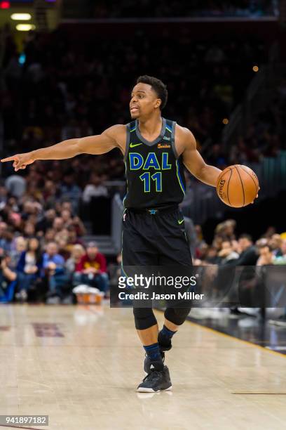 Yogi Ferrell of the Dallas Mavericks calls a play during the first half against the Cleveland Cavaliers at Quicken Loans Arena on April 1, 2018 in...