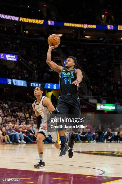 Yogi Ferrell of the Dallas Mavericks shoots over Jordan Clarkson of the Cleveland Cavaliers during the first half at Quicken Loans Arena on April 1,...