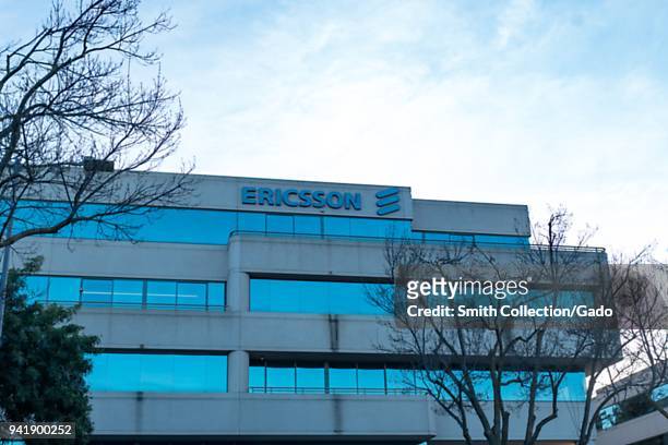 Facade with sign and logo at regional headquarters of mobile device company Ericsson in Pleasanton, California, March 26, 2018.