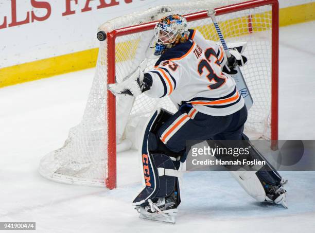 Cam Talbot of the Edmonton Oilers makes a glove save against the Minnesota Wild during the game on April 2, 2018 at Xcel Energy Center in St Paul,...