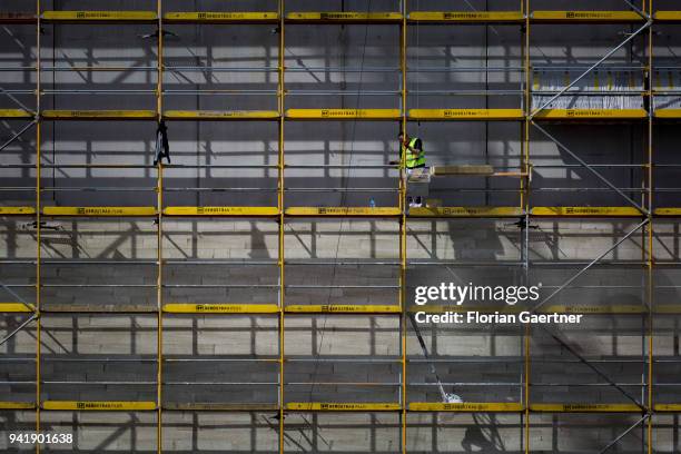 Construction worker while working on a scaffold on April 04, 2018 in Berlin, Germany.