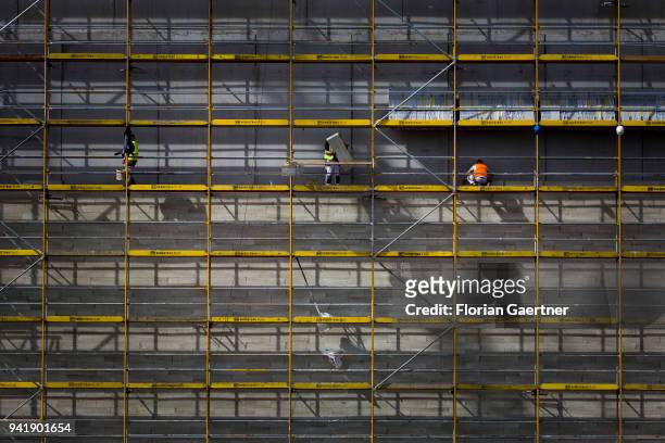 Construction worker while working on a scaffold on April 04, 2018 in Berlin, Germany.