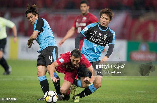 Okubo Yoshito , Kurumaya Shintaro of Kawasaki Frontale and Akhmedov of Shanghai SIPG in action during the 2018 AFC Champions League match between...