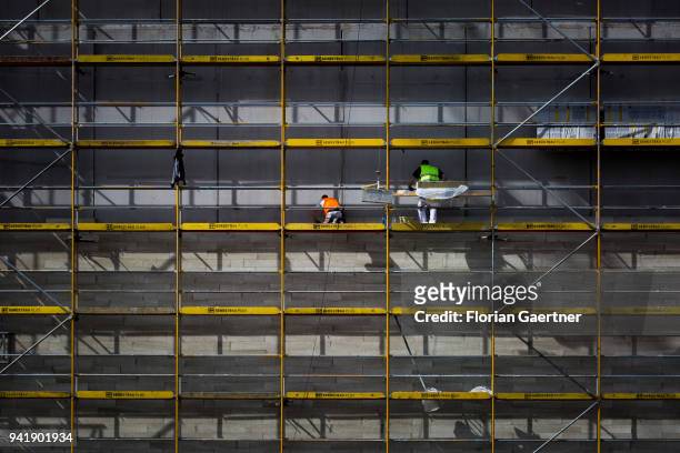 Construction worker while working on a scaffold on April 04, 2018 in Berlin, Germany.