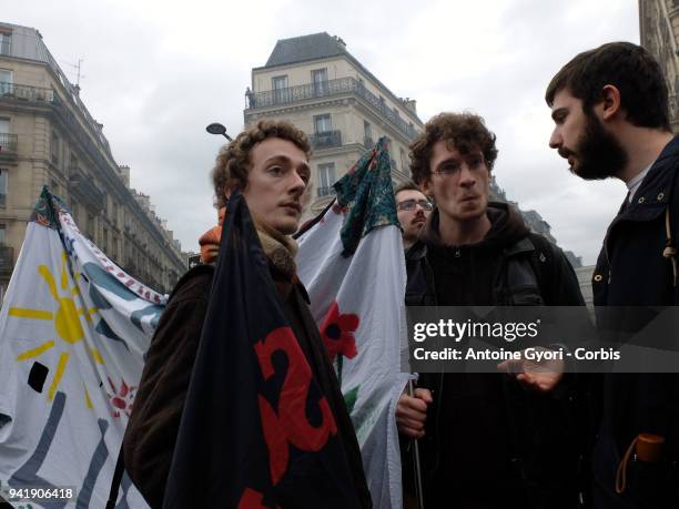 Protesters walk during a protest march by railway workers, other labor union members and studiant in Paris, France, on Tuesday April 3, 2018. Trains...