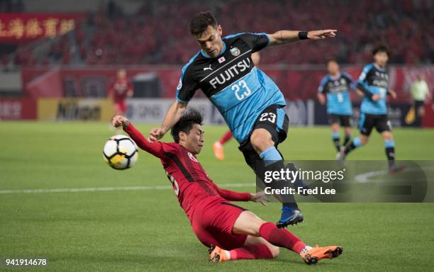 Carlos Eduardo Bendini Giusti of Kawasaki Frontale and Fu Huan of Shanghai SIPG in action during the 2018 AFC Champions League match between Shanghai...