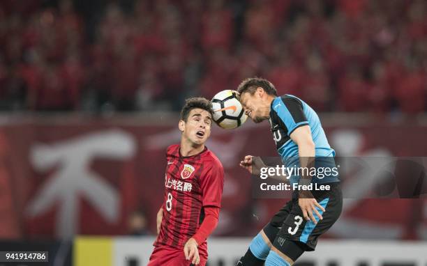 Oscar of Shanghai SIPG and Nara Tatsuki of Kawasaki Frontale in action during the 2018 AFC Champions League match between Shanghai SIPG and Kawasaki...