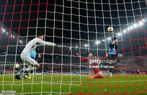 Hasegawa Tatsuya of Kawasaki Frontale and Fu Huan of Shanghai SIPG in action during the 2018 AFC Champions League match between Shanghai SIPG and...