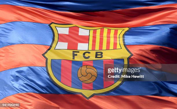The Barcelona logo is seen on a flag waving above the stadium prior to the UEFA Champions League Quarter Final Leg One match between FC Barcelona and...