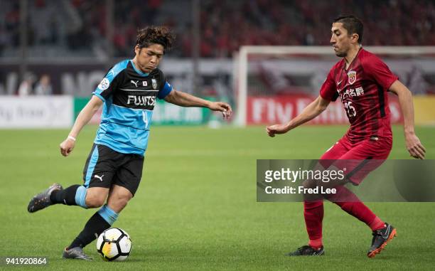 Okubo Yoshito of Kawasaki Frontale and Akhmedov of Shanghai SIPG in action during the 2018 AFC Champions League match between Shanghai SIPG and...