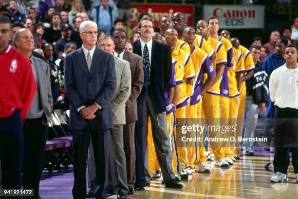 Byron Scott of the Los Angeles Lakers stands for the national anthem before the game against the Miami Heat at the Great Western Forum on January...