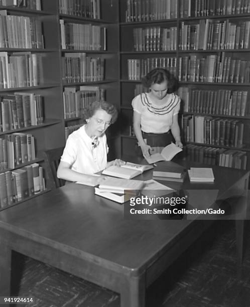 Two Centers for Disease Control employees working in the campus library, Chamblee, Georgia, 1952. Image courtesy Centers for Disease Control .