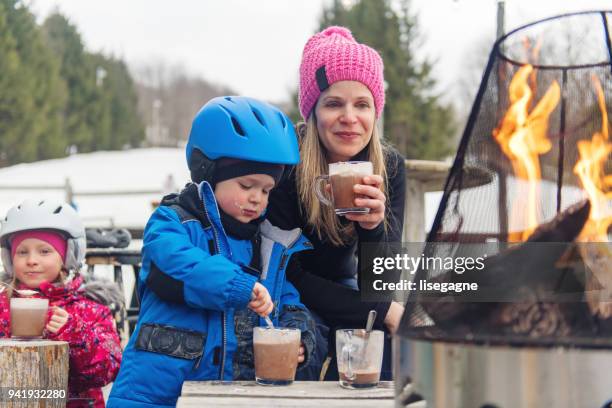 families and friends in a ski resort - family skiing stock pictures, royalty-free photos & images
