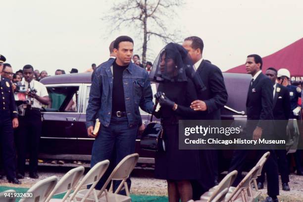 American Civil Rights activist Andrew Young escorts mourners to their seats during Dr Martin Luther King Jr's burial service at South View Cemetery,...